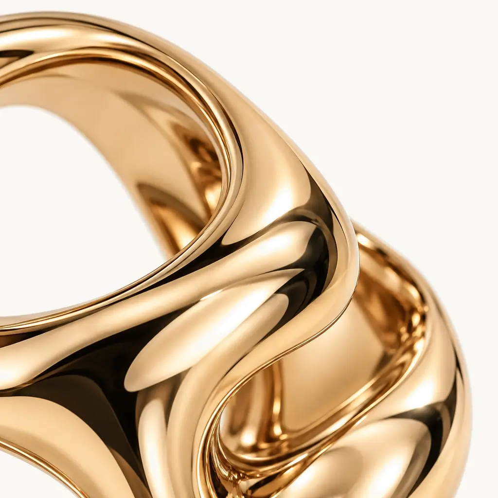 Macro of polished gold folding through itself